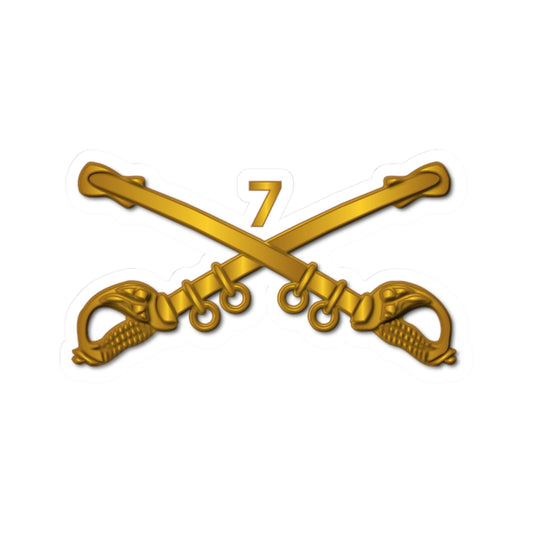 A gold-colored sticker in the shape of a cross with the number 7 and a star, representing the 7th Cavalry Branch.