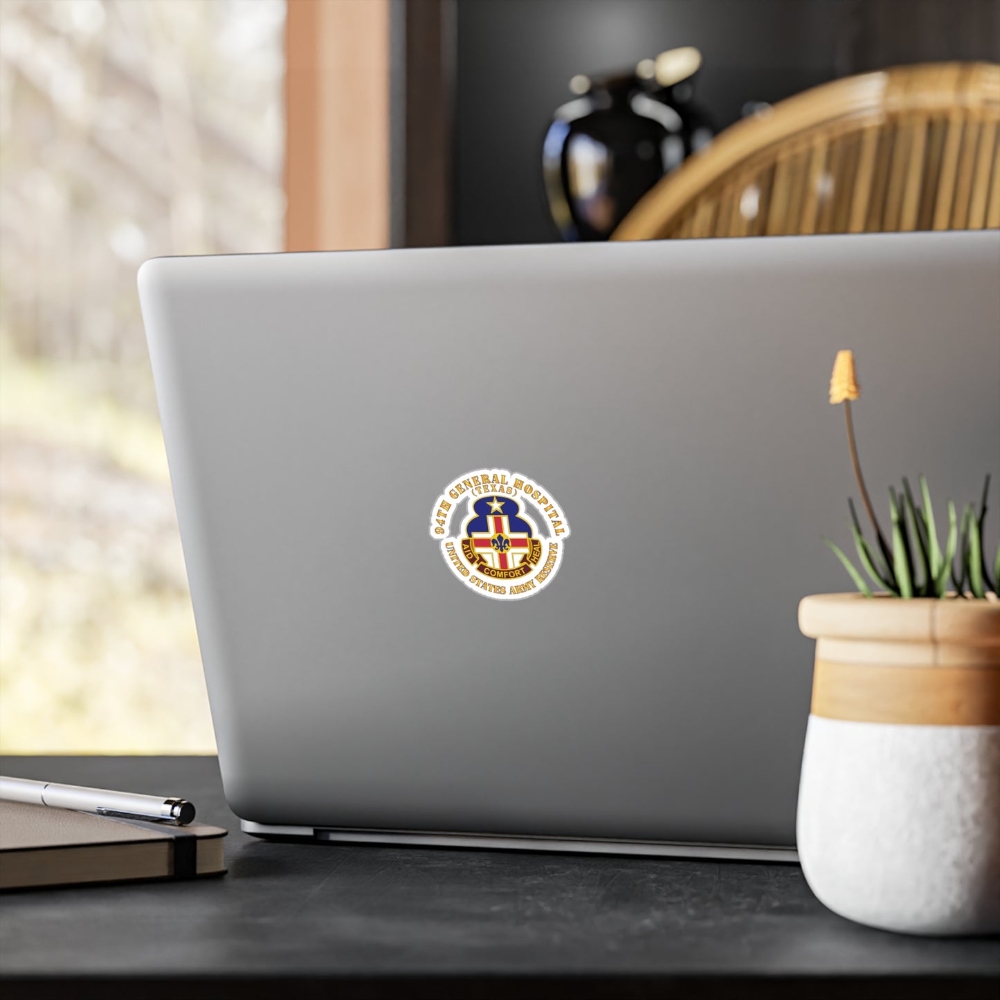 A circular white vinyl decal with a colorful emblem representing the 94th General Hospital, Texas, in the center.