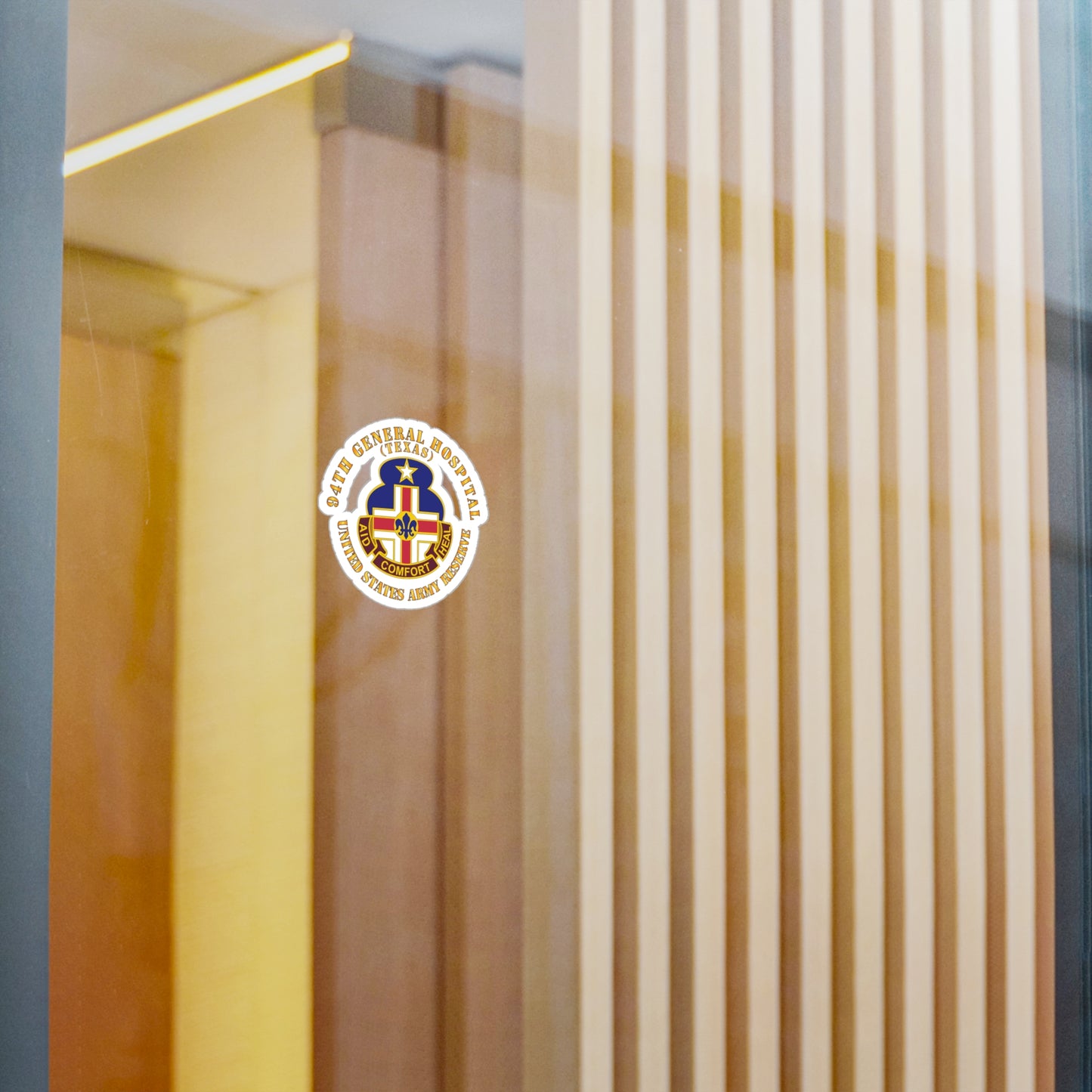 A circular white vinyl decal with a colorful emblem representing the 94th General Hospital, Texas, in the center.