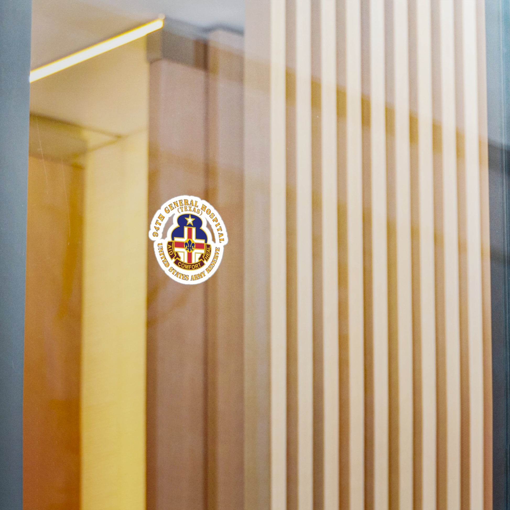 A circular white vinyl decal with a colorful emblem representing the 94th General Hospital, Texas, in the center.