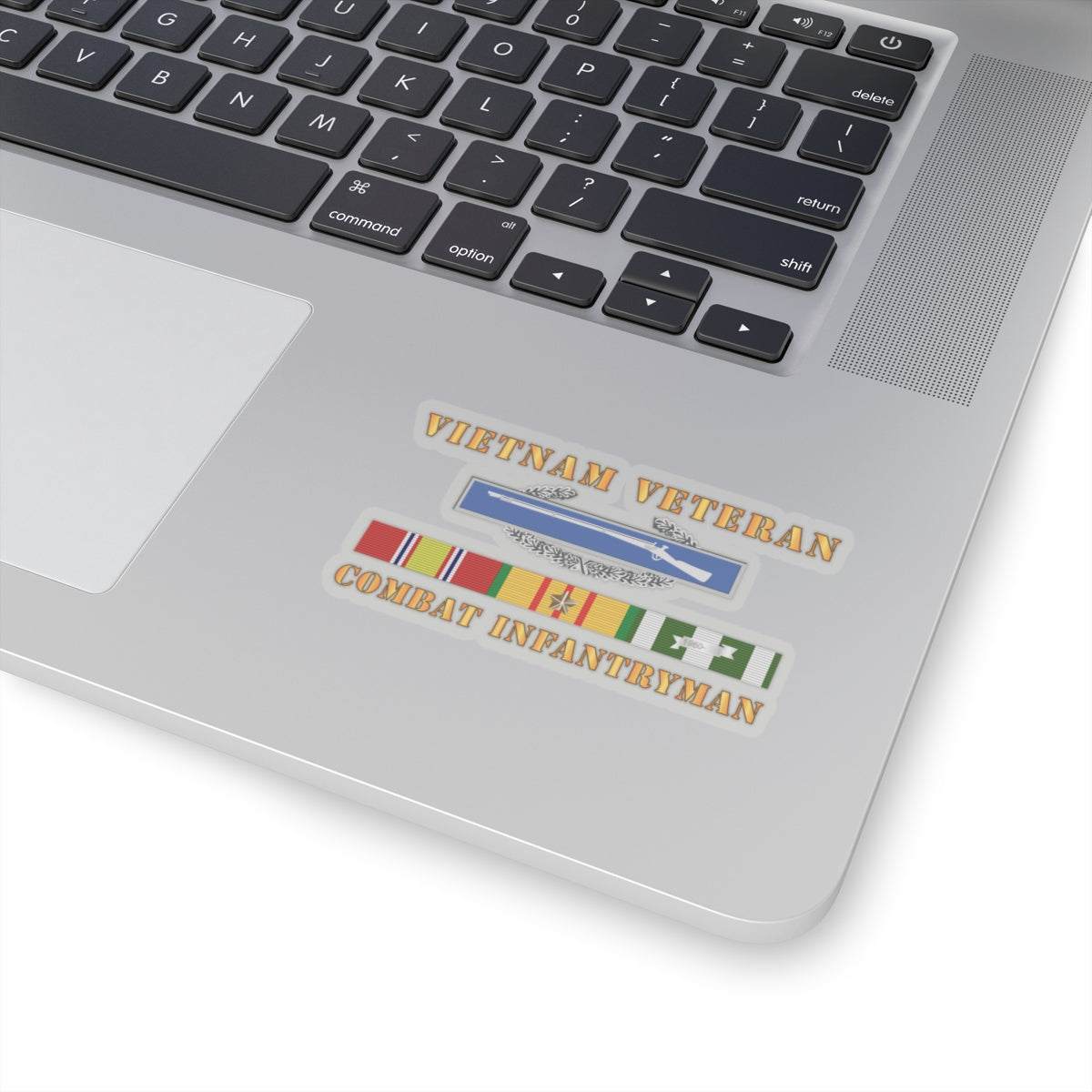 A sticker with a 'VIETNAM VETERAN COMBAT INFANTRYMAN' text and an image of a rifle above a ribbon badge.