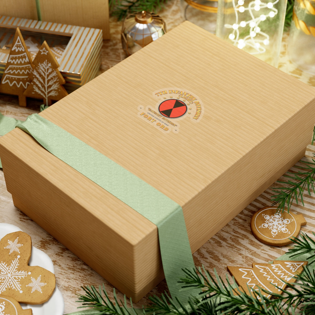 Wooden gift box with a green ribbon on a festive background with cookies and decorations.
