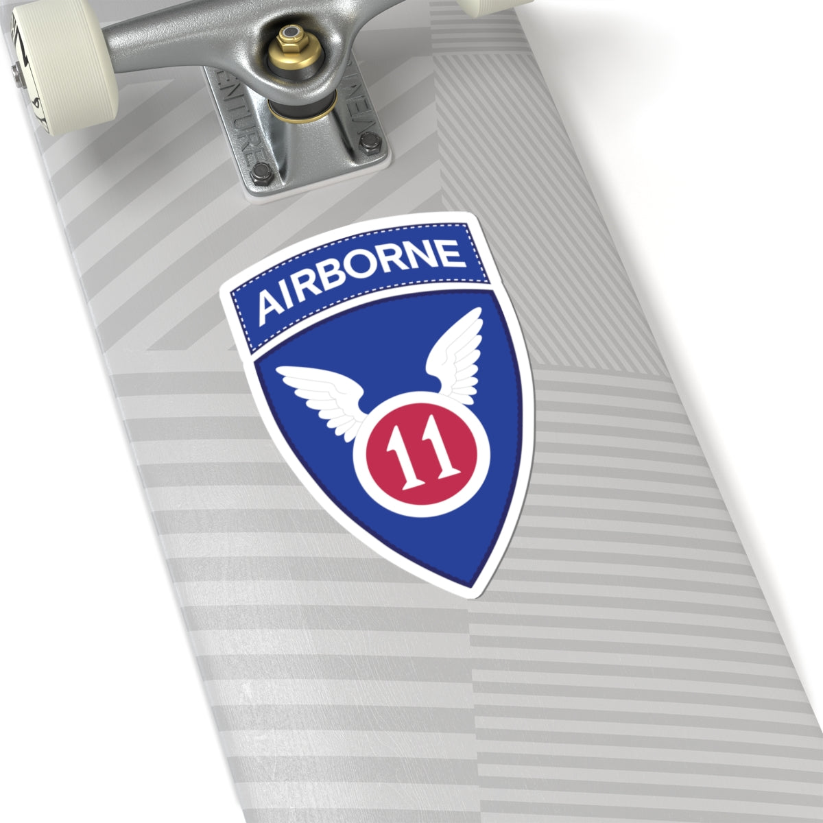 A kiss-Cut Stickers depicting the The 11th Airborne Division, known as the "Angels," is a historic U.S. Army airborne unit. Its shoulder sleeve insignia (SSI) features a red winged sword (symbolizing speed and striking power) on a blue background with a white border.