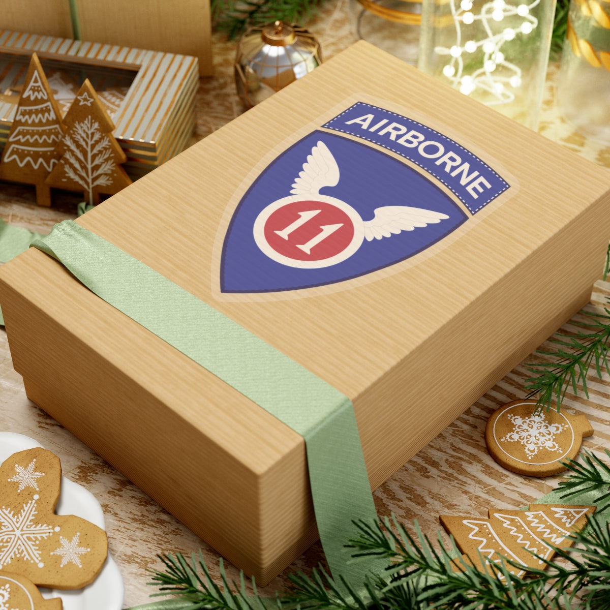 A kiss-Cut Stickers depicting the The 11th Airborne Division, known as the "Angels," is a historic U.S. Army airborne unit. Its shoulder sleeve insignia (SSI) features a red winged sword (symbolizing speed and striking power) on a blue background with a white border.