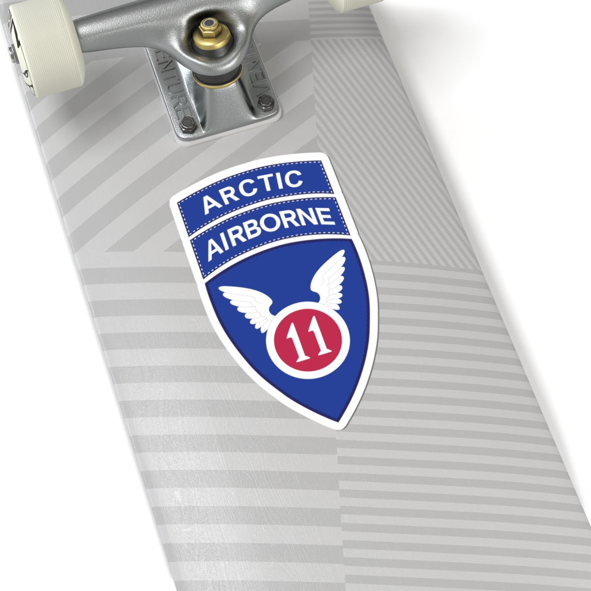 A kiss-Cut Stickers depicting the 11th Airborne Division, reactivated in 2022, is a U.S. Army unit specializing in cold-weather and Arctic operations. Nicknamed the "Arctic Angels," its shoulder sleeve insignia (SSI) features a red angel wing and sword on a blue background, and it is often worn with the "Arctic" tab to denote its mission focus.