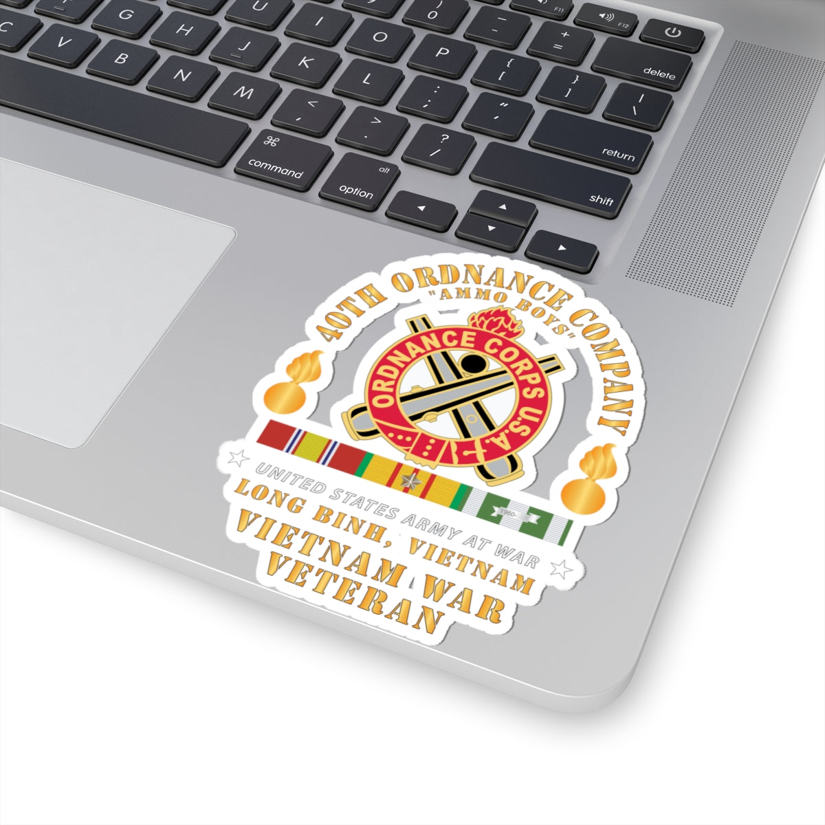 A sticker with the 40th Ordnance Company emblem, featuring a flaming bomb symbol, and text indicating service in Vietnam.