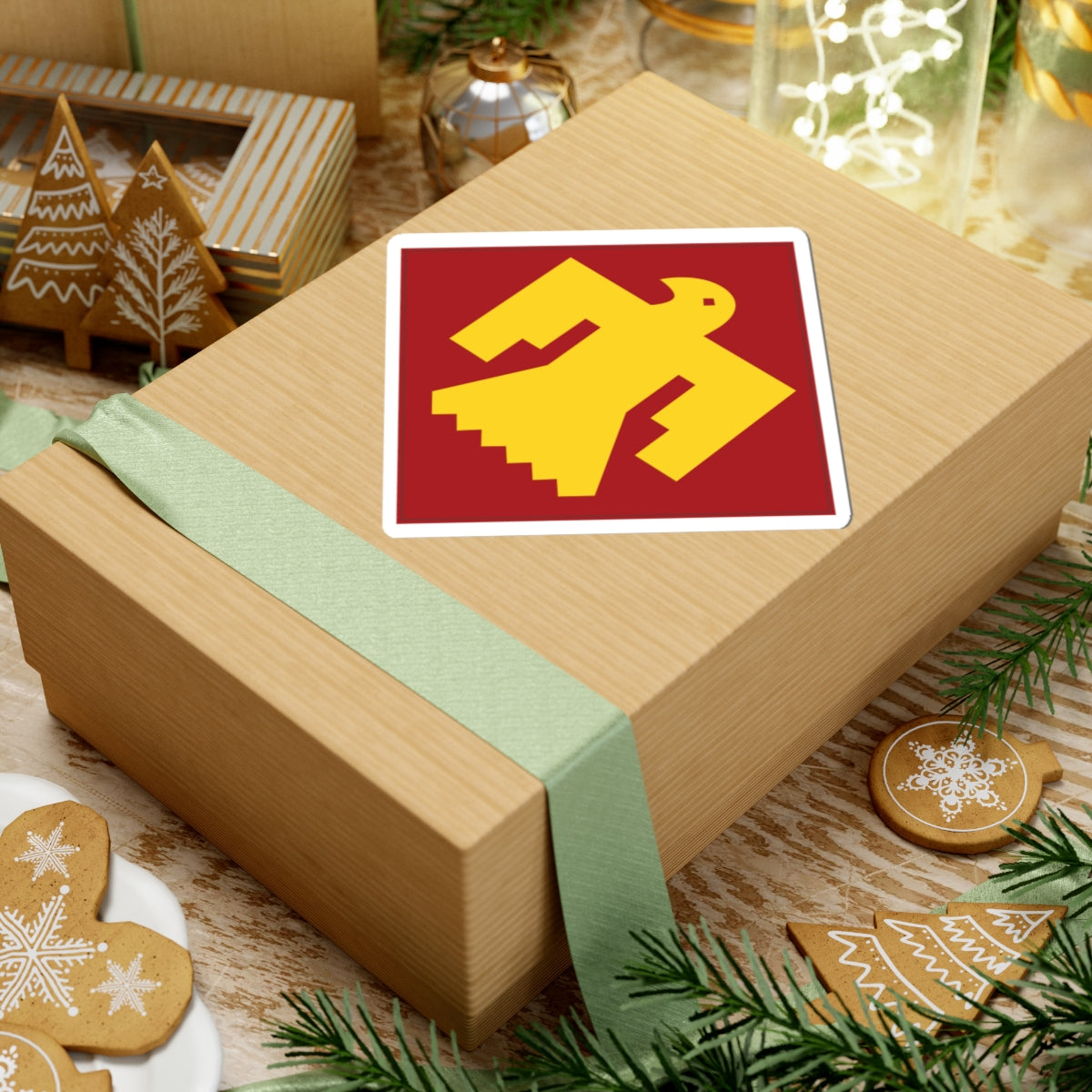 A kiss-Cut Stickers depicting The 45th Infantry Division, known as the "Thunderbird Division," was a National Guard unit primarily made up of troops from Oklahoma, New Mexico, Colorado, and Arizona. Its shoulder sleeve insignia (SSI) features a red Thunderbird on a gold background, symbolizing Native American heritage and strength.