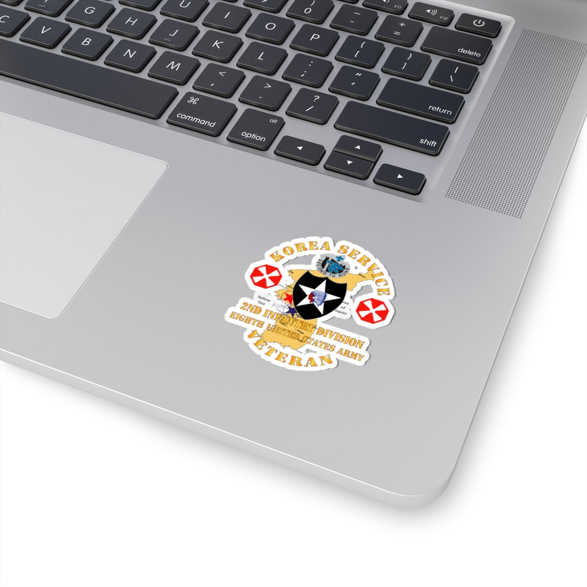 A sticker with a graphic representing the Korea Service Veteran, 2nd Infantry Division, 8th United States Army. It features a map of Korea, a star, and decorative elements in a circular design.