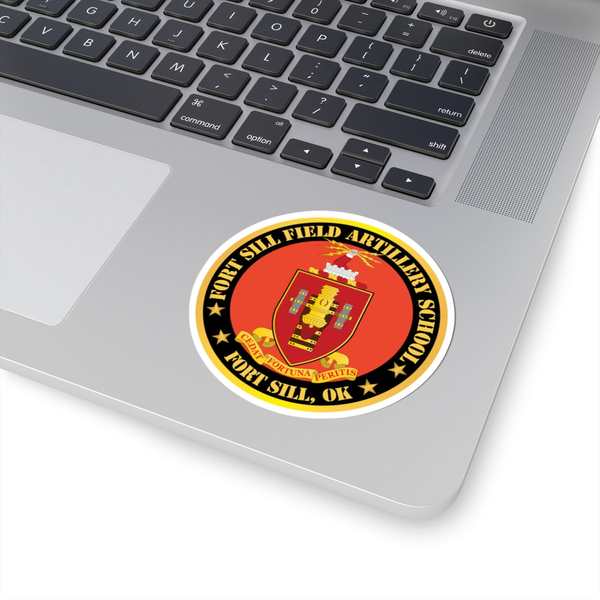 A circular red and gold sticker with the coat of arms of Fort Sill Field Artillery School, including a star and the text 'FORT SILL, OK'.