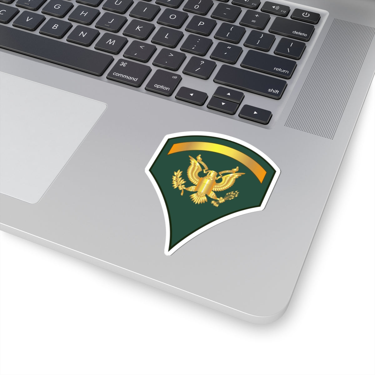 A sticker with a dark blue background featuring a gold-colored eagle emblem and a golden banner.