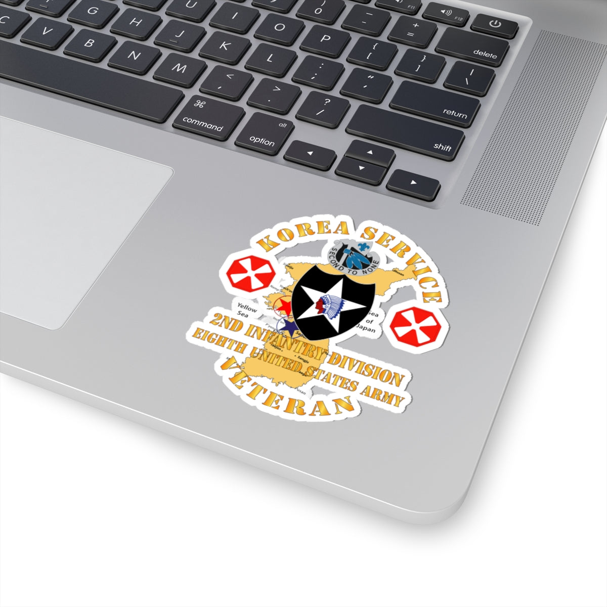 A sticker with a graphic representing the Korea Service Veteran, 2nd Infantry Division, 8th United States Army. It features a map of Korea, a star, and decorative elements in a circular design.