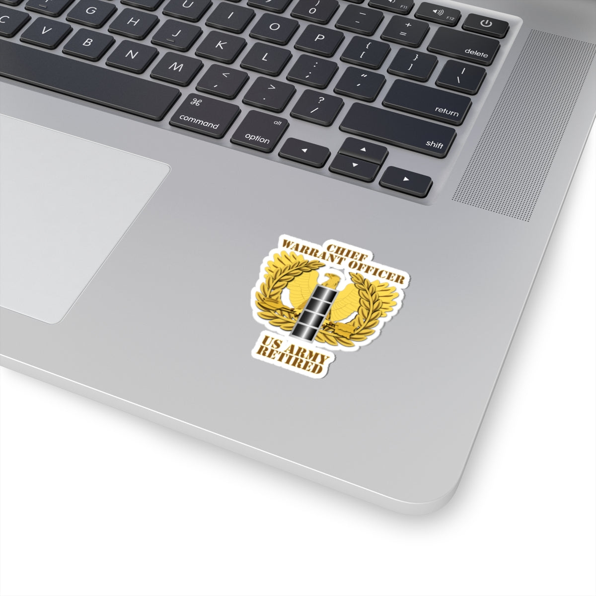 A emblem sticker with the text 'CHIEF WARRANT OFFICER US ARMY RETIRED' designed in a military style with a gold background, a silver star, and laurel wreath.