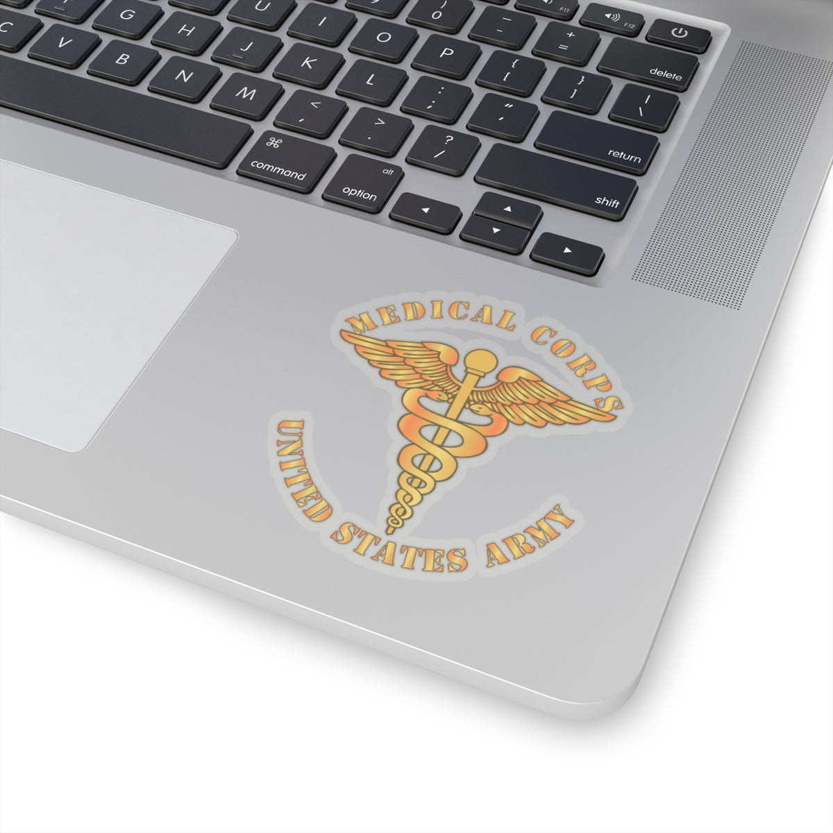 A sticker with the emblem of the United States Army Medical Corps, featuring a caduceus with wings and the text 'MEDICAL CORPS UNITED STATES ARMY'.
