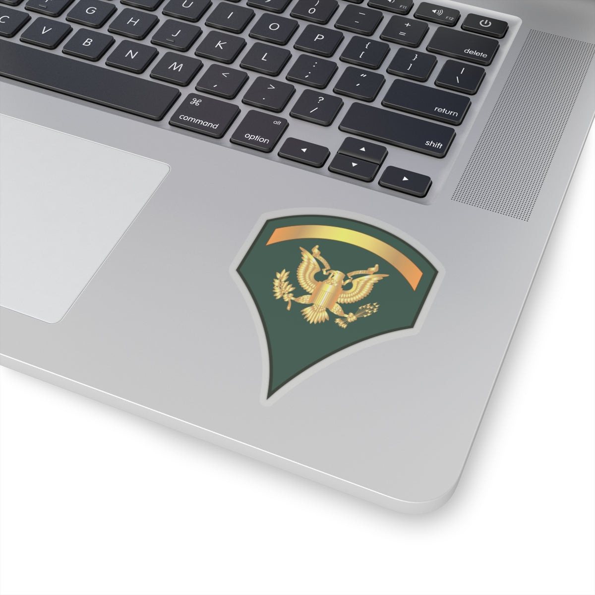 A sticker with a dark blue background featuring a gold-colored eagle emblem and a golden banner.