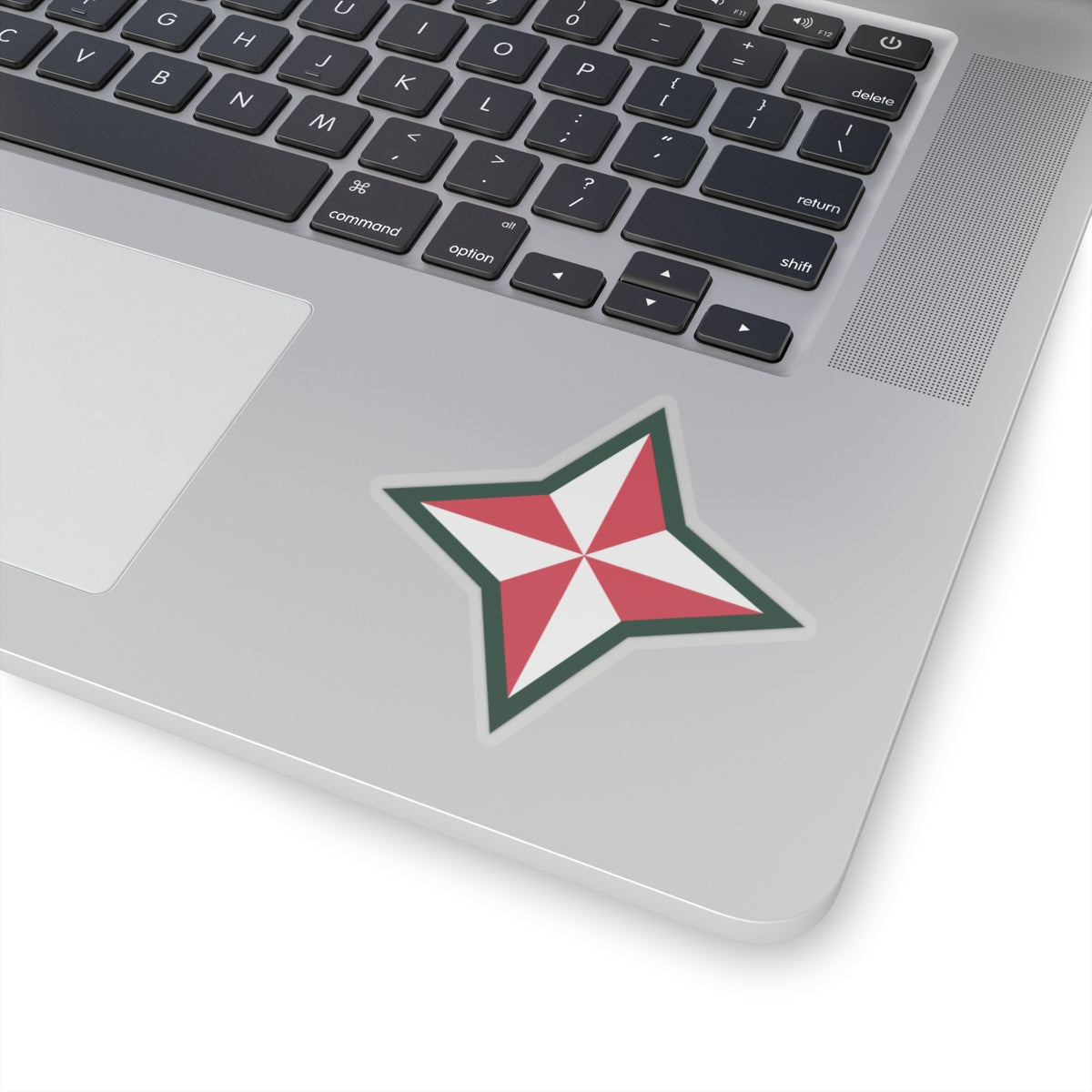 A shaped sticker with a design that resembles a star, predominantly white with red and green accents, likely representing the 48th Infantry Division.