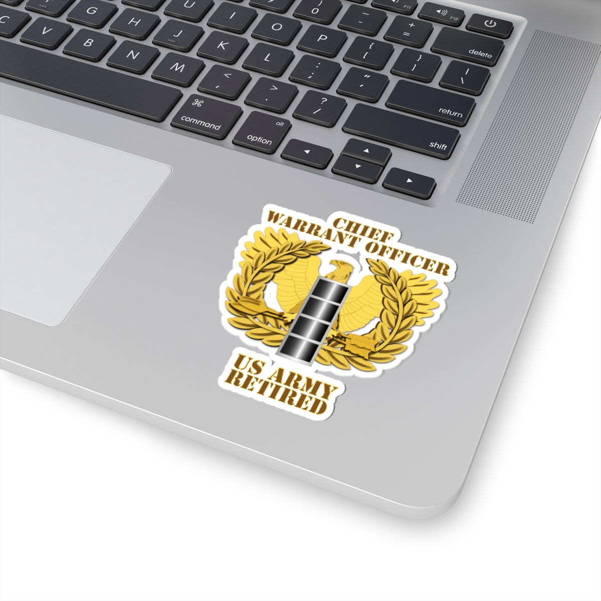 A emblem sticker with the text 'CHIEF WARRANT OFFICER US ARMY RETIRED' designed in a military style with a gold background, a silver star, and laurel wreath.