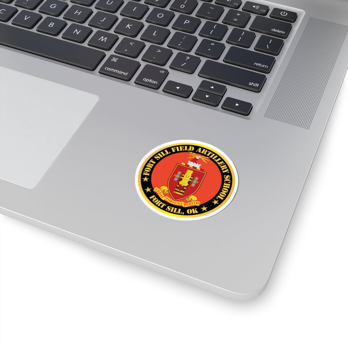 A circular red and gold sticker with the coat of arms of Fort Sill Field Artillery School, including a star and the text 'FORT SILL, OK'.