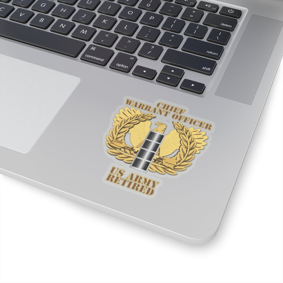 A emblem sticker with the text 'CHIEF WARRANT OFFICER US ARMY RETIRED' designed in a military style with a gold background, a silver star, and laurel wreath.