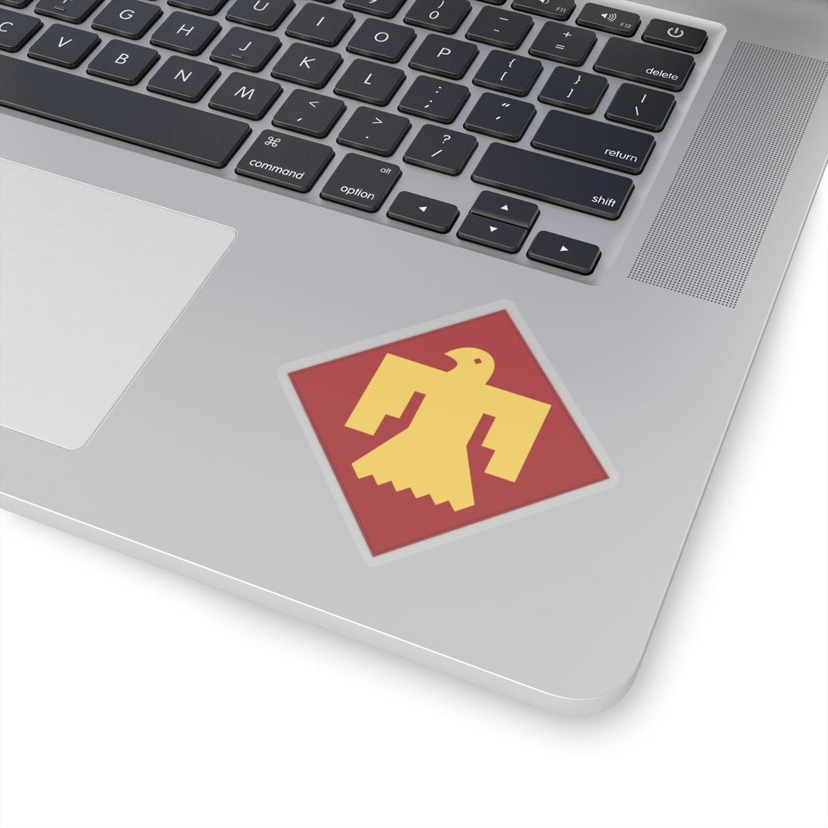 A kiss-Cut Stickers depicting The 45th Infantry Division, known as the "Thunderbird Division," was a National Guard unit primarily made up of troops from Oklahoma, New Mexico, Colorado, and Arizona. Its shoulder sleeve insignia (SSI) features a red Thunderbird on a gold background, symbolizing Native American heritage and strength.