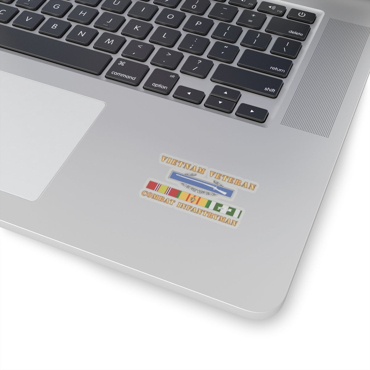 A sticker with a 'VIETNAM VETERAN COMBAT INFANTRYMAN' text and an image of a rifle above a ribbon badge.