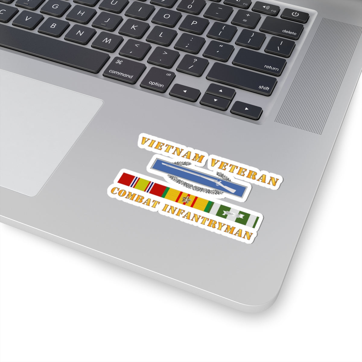 A sticker with a 'VIETNAM VETERAN COMBAT INFANTRYMAN' text and an image of a rifle above a ribbon badge.