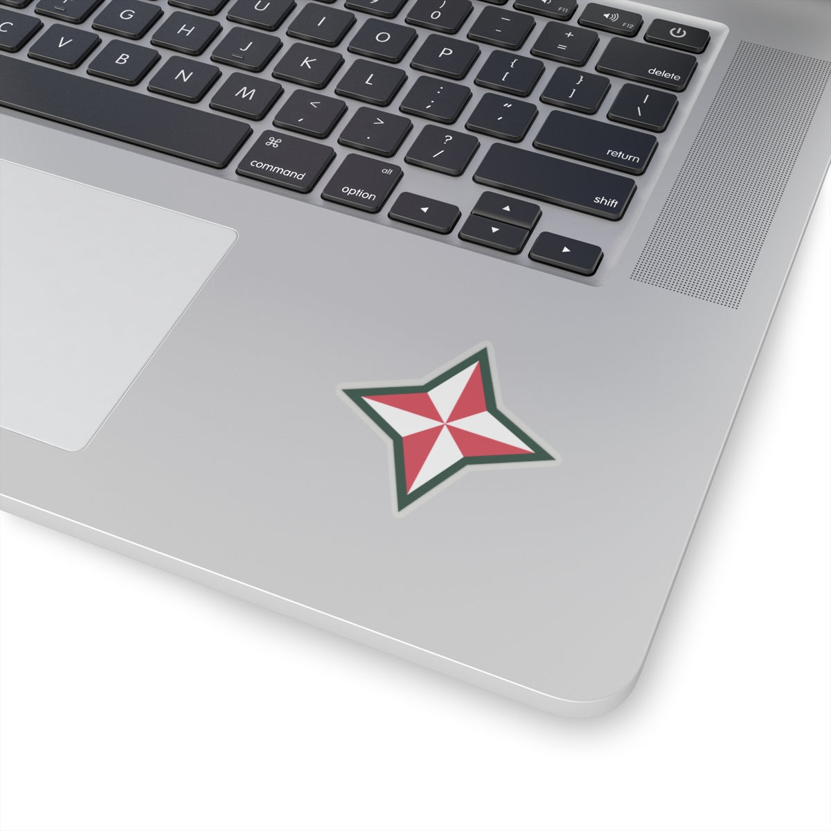 A shaped sticker with a design that resembles a star, predominantly white with red and green accents, likely representing the 48th Infantry Division.