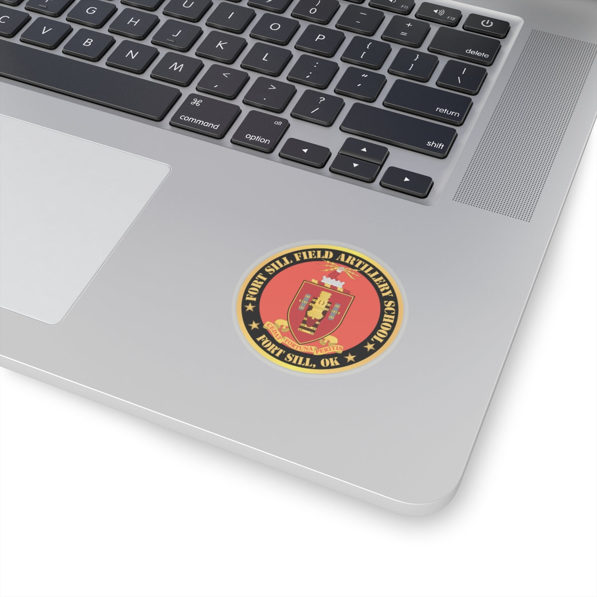  circular red and gold sticker with the coat of arms of Fort Sill Field Artillery School, including a star and the text 'FORT SILL, OK'.