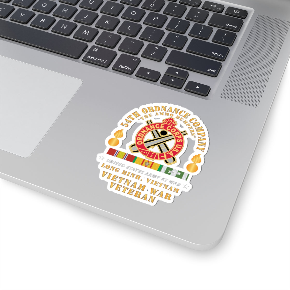 A sticker featuring the emblem of the 54th Ordnance Company with a 'Vietnam War Veteran' inscription and decorative elements in red, white, and yellow colors.