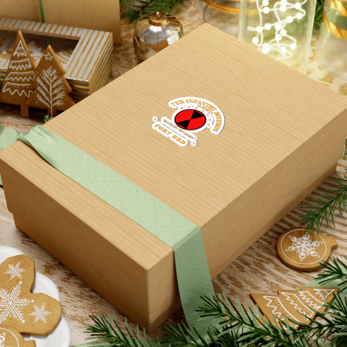 Wooden gift box with a green ribbon on a festive background with cookies and decorations.