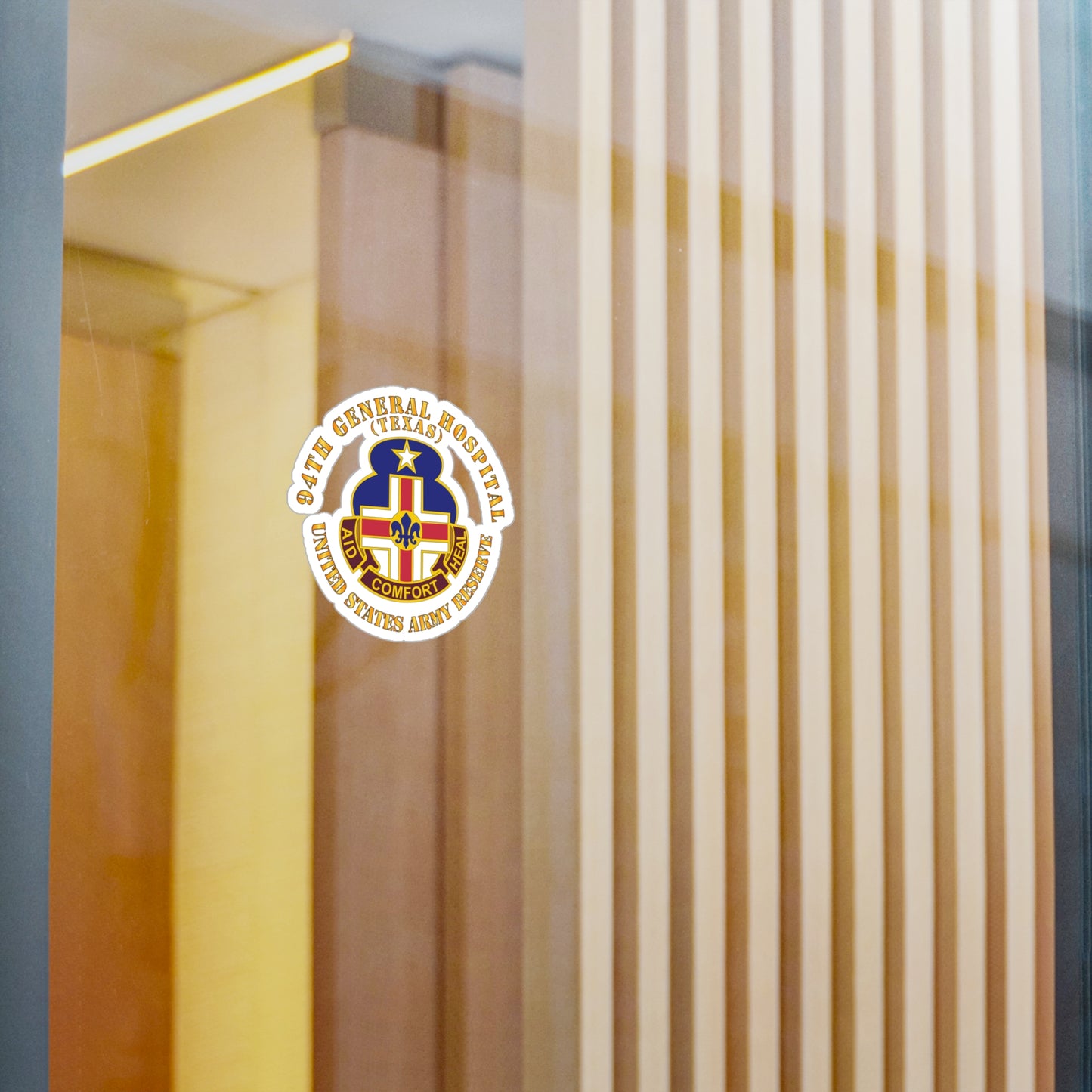 A circular white vinyl decal with a colorful emblem representing the 94th General Hospital, Texas, in the center.