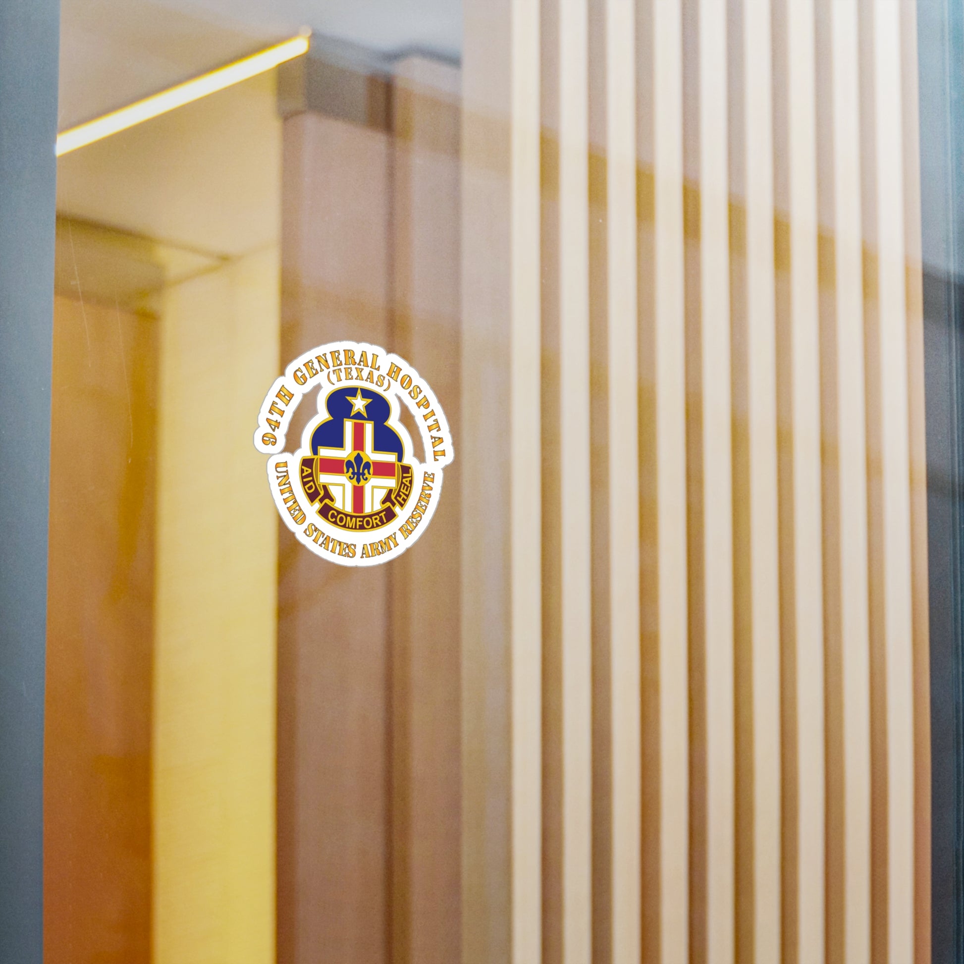 A circular white vinyl decal with a colorful emblem representing the 94th General Hospital, Texas, in the center.