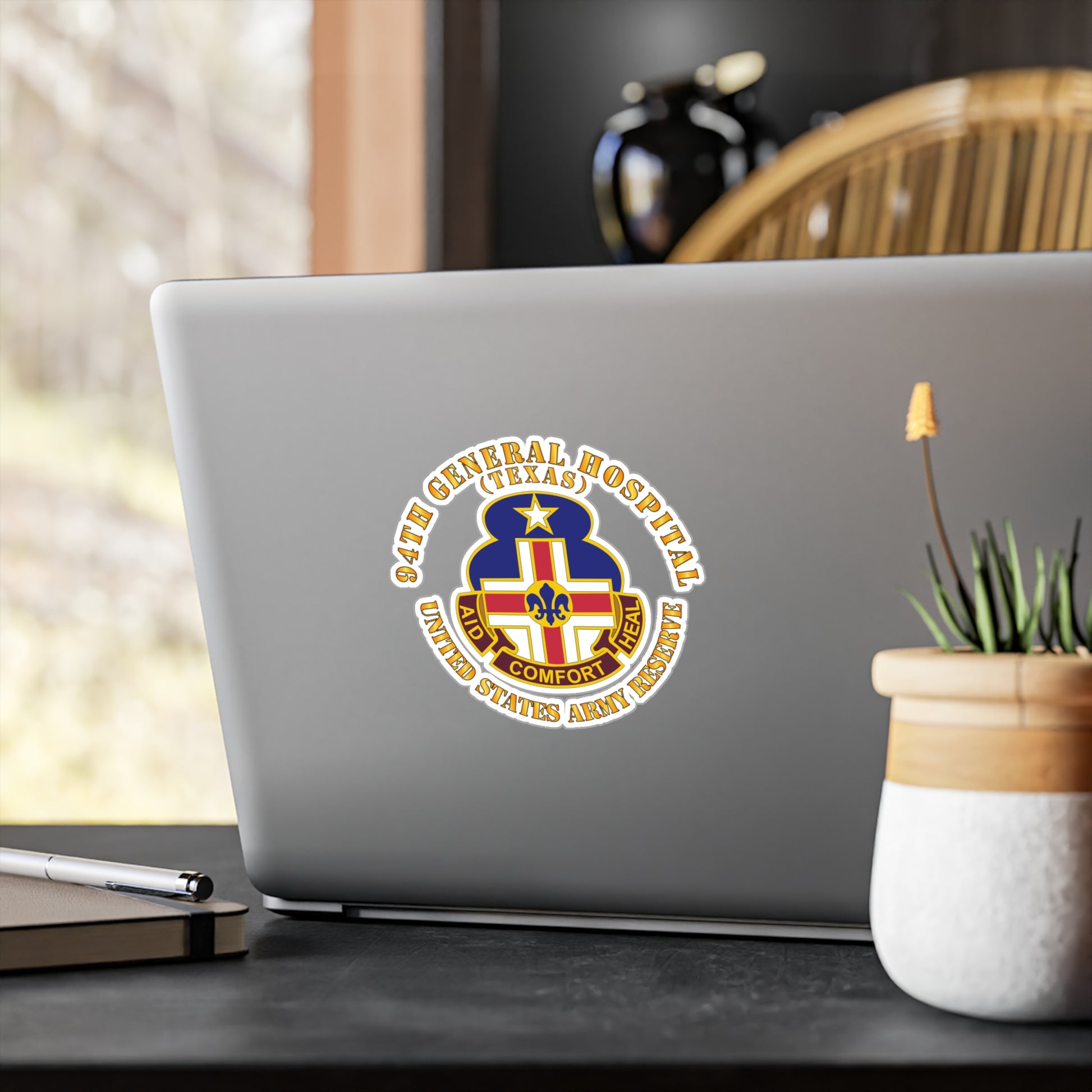 A circular white vinyl decal with a colorful emblem representing the 94th General Hospital, Texas, in the center.