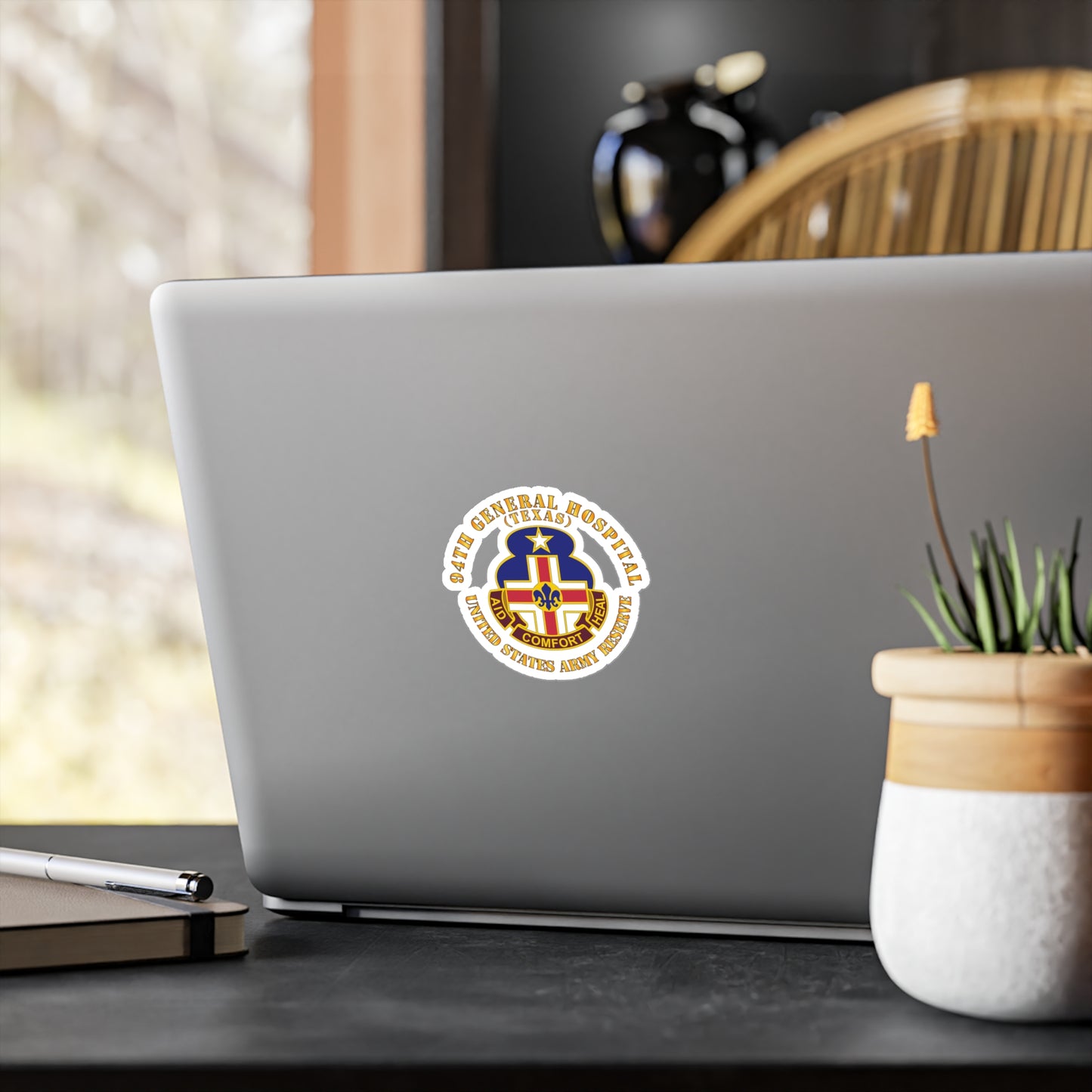 A circular white vinyl decal with a colorful emblem representing the 94th General Hospital, Texas, in the center.
